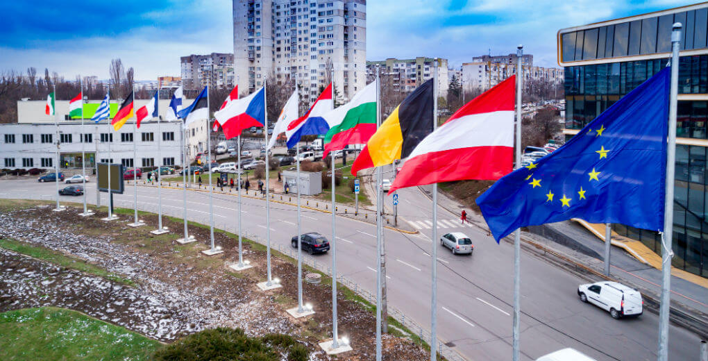 European union flags and green card