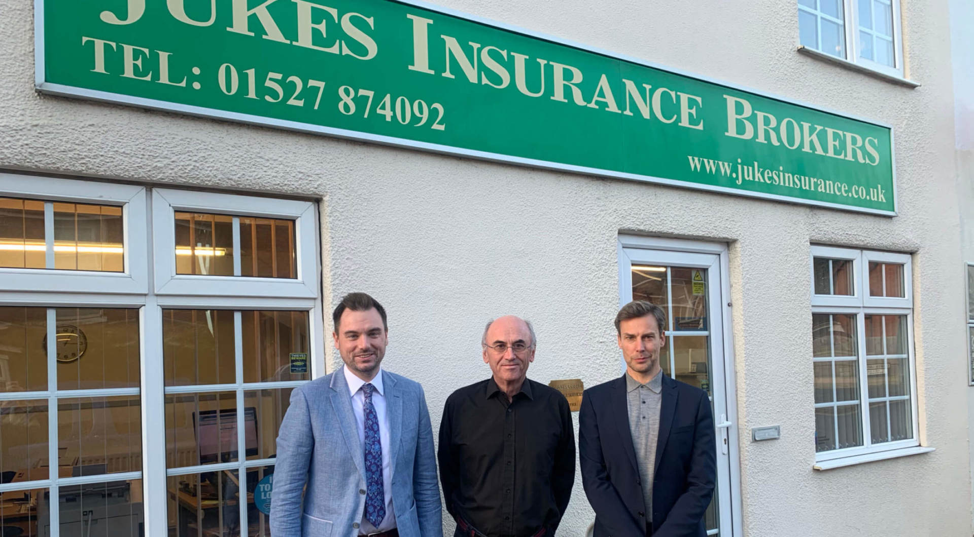 Picture outside Jukes Insurance Brokers office with new managing director and co-directors